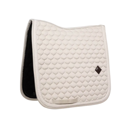 Beige colored dressage saddle pad