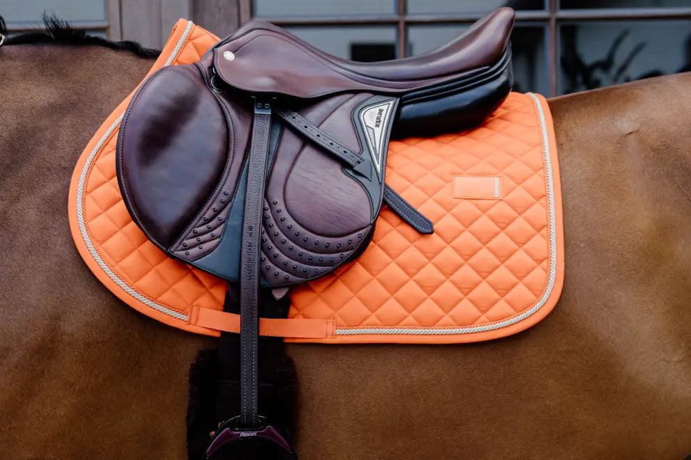 Orange jumping saddle pad