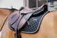 Anatomic saddle pad